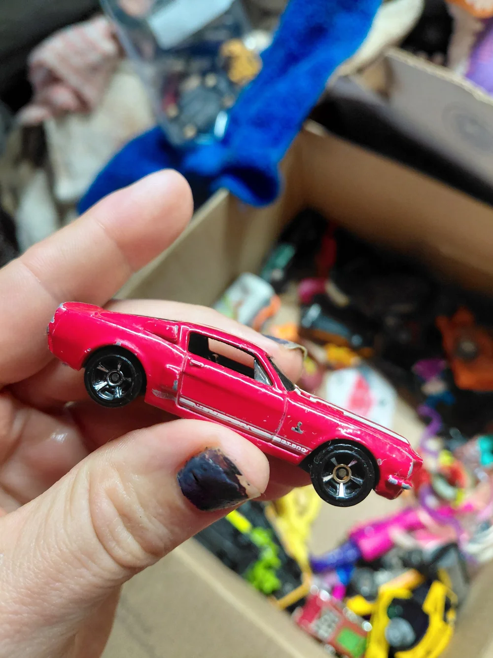 red 1968 Shelby GT500 diecast car by Hot Wheels